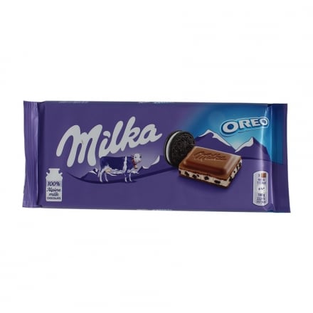 Шоколад 100г Milka молочний з кремовою начинкою та шматочками печива Орео