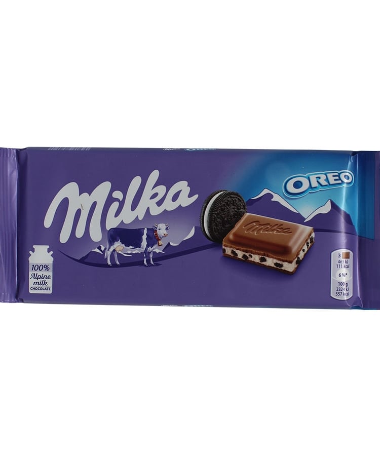 Шоколад 100г Milka молочний з кремовою начинкою та шматочками печива Орео